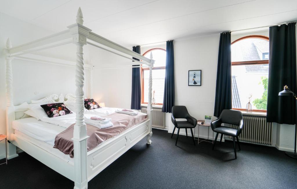 Postel nebo postele na pokoji v ubytování Hotel Phønix Brønderslev