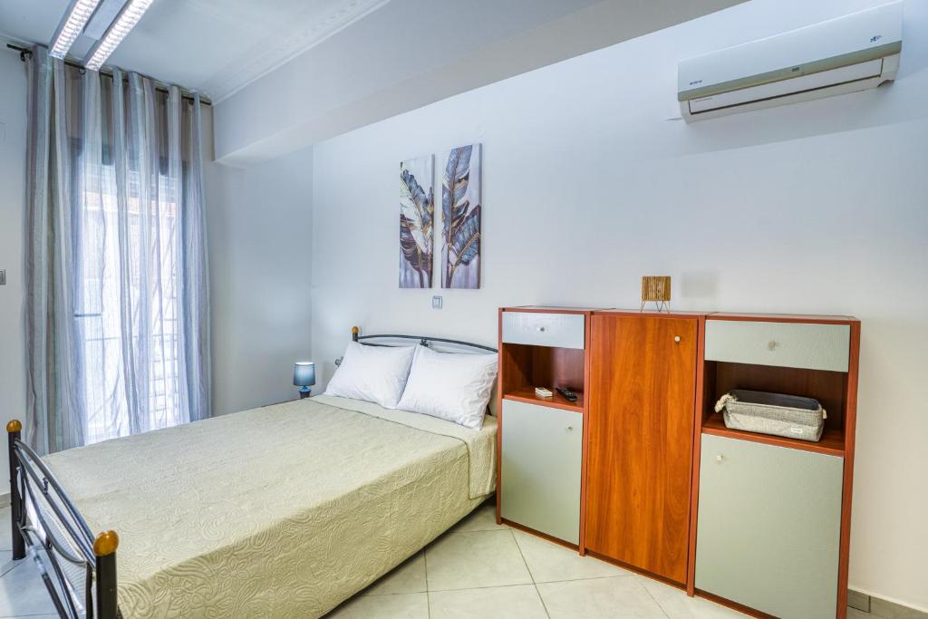 Ένα ή περισσότερα κρεβάτια σε δωμάτιο στο Central Aplotaria Apartment