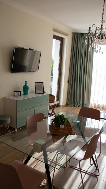 Μια τηλεόραση ή/και κέντρο ψυχαγωγίας στο Guest House Botanical Paradise