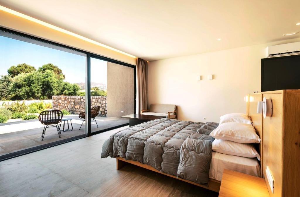 Katil atau katil-katil dalam bilik di Aethrion Villas & Suites