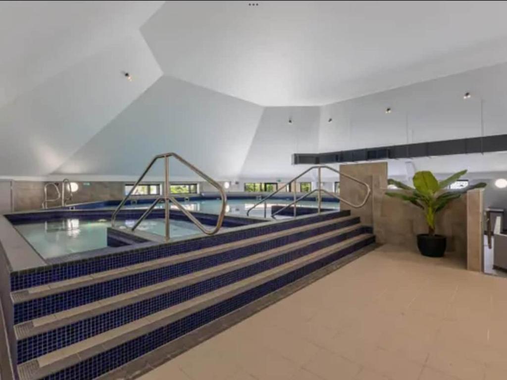 a swimming pool on the top of a building at Bliss on the Bay at Waterside Holiday Park in Paignton