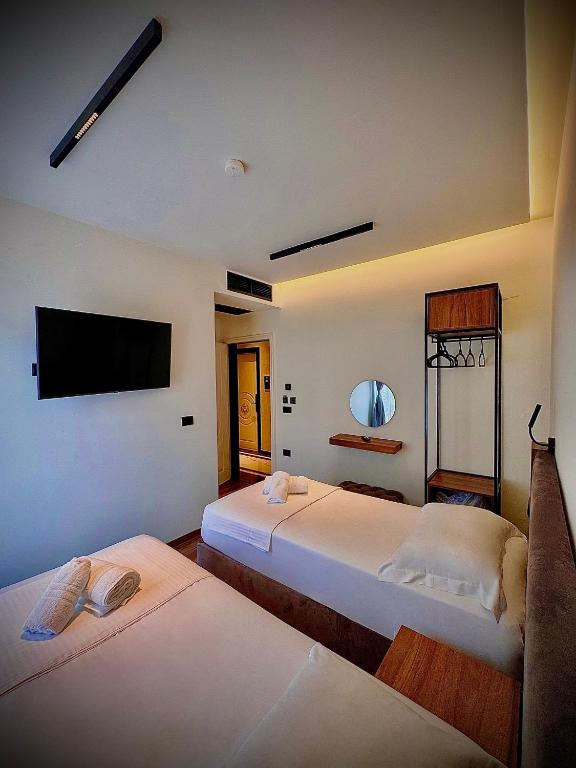 Postel nebo postele na pokoji v ubytování Martin Luxury Hotel