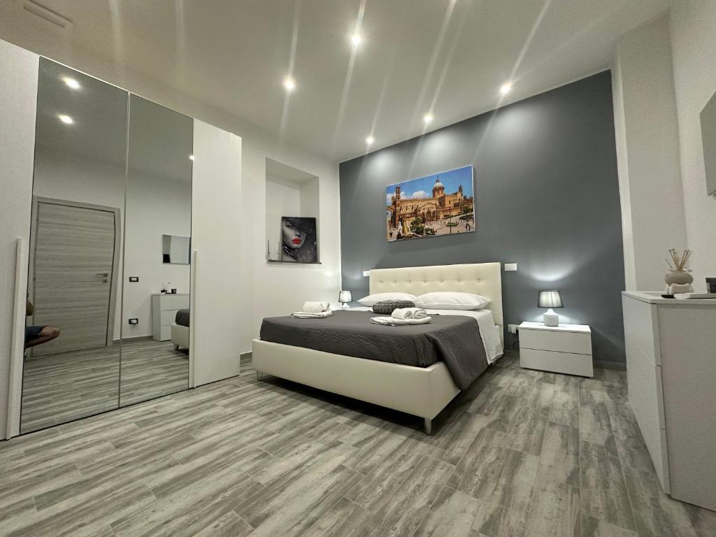 Ένα ή περισσότερα κρεβάτια σε δωμάτιο στο Blue Wave Apartment