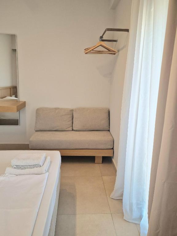 Postel nebo postele na pokoji v ubytování NAMI Seaside