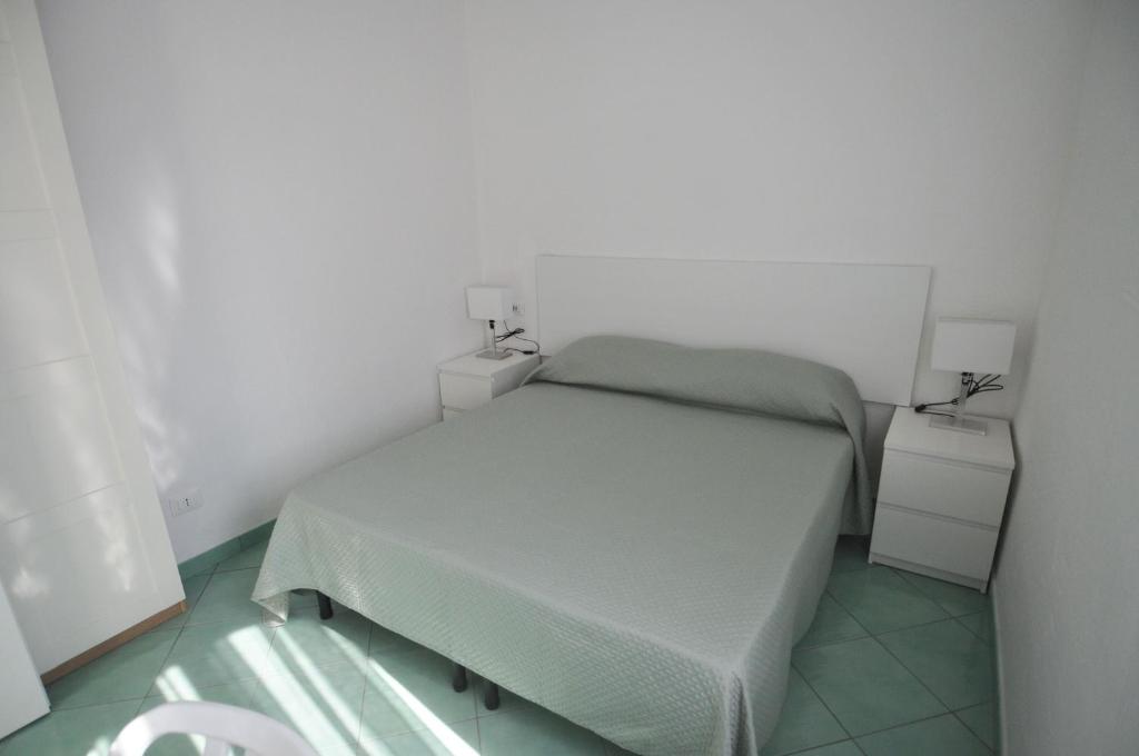 Postel nebo postele na pokoji v ubytování Appartamenti I Lauri