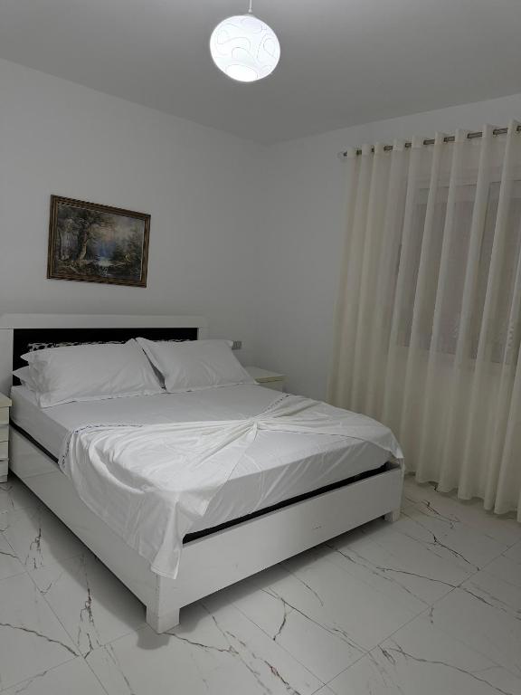 Postel nebo postele na pokoji v ubytování Fabio Rent House