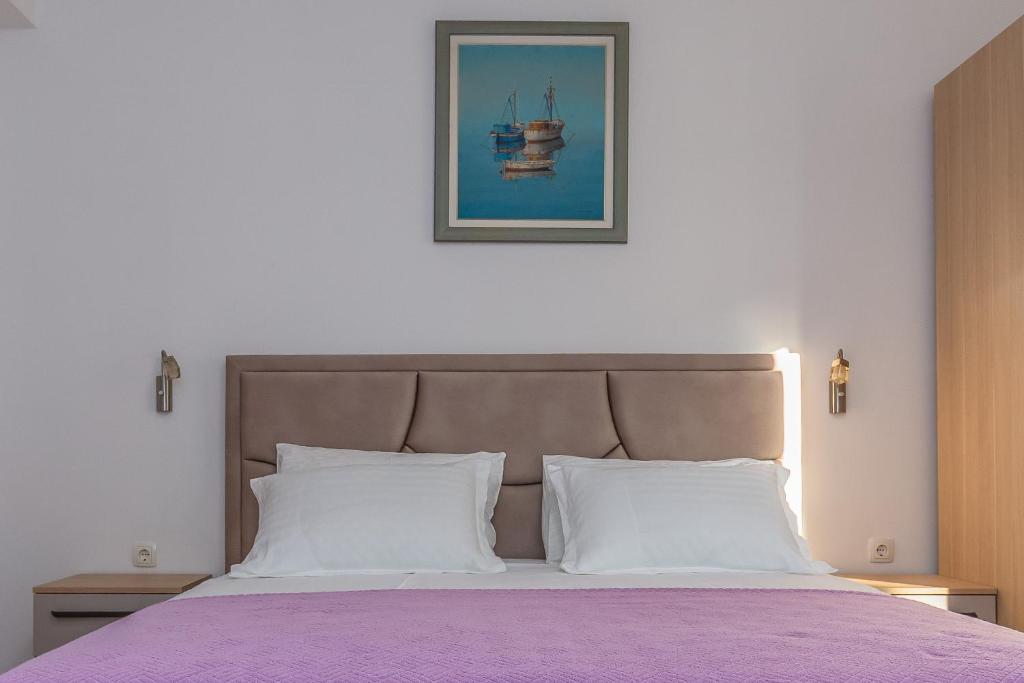 Postel nebo postele na pokoji v ubytování Rooms Ivka