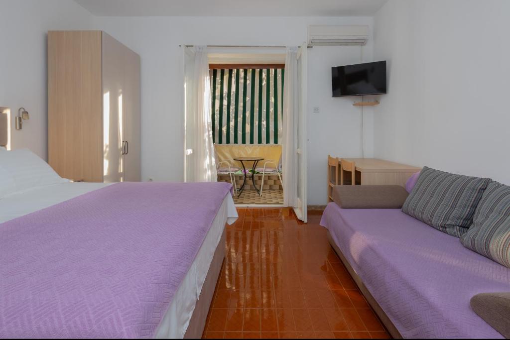 Postel nebo postele na pokoji v ubytování Rooms Ivka
