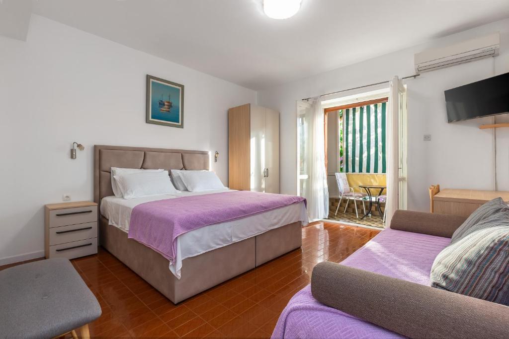 Postel nebo postele na pokoji v ubytování Rooms Ivka