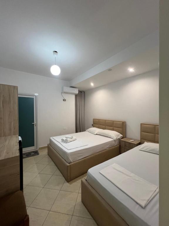 Postel nebo postele na pokoji v ubytování Hotel Villa Flowers 2