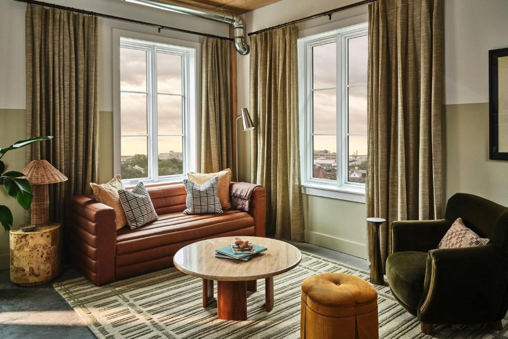 a living room with a couch and a table at The Ann Savannah, Apartments by Marriott Bonvoy in Savannah