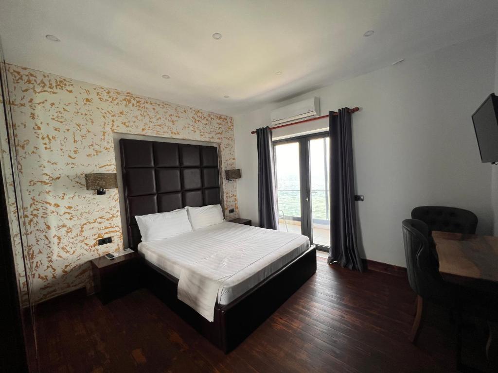 Voodi või voodid majutusasutuse Hotel Victoria toas