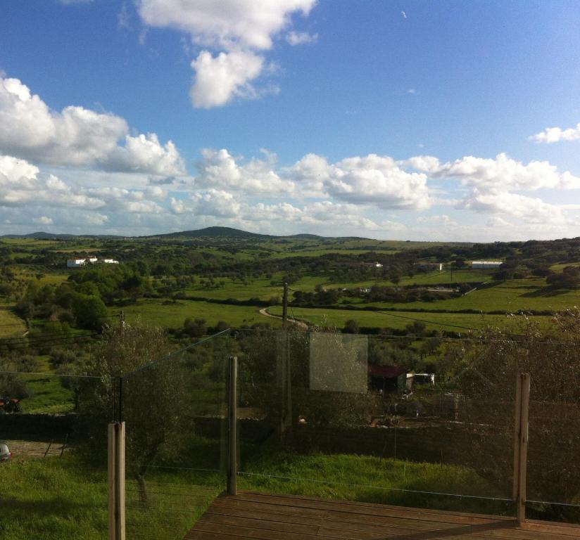 a view of a green field with a blue sky at Retiro da cegonha in Crato