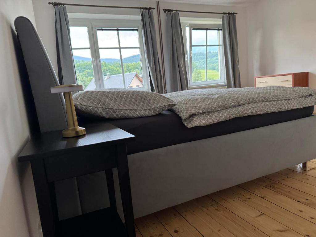 Postel nebo postele na pokoji v ubytování Apartmány Kanteho grunt