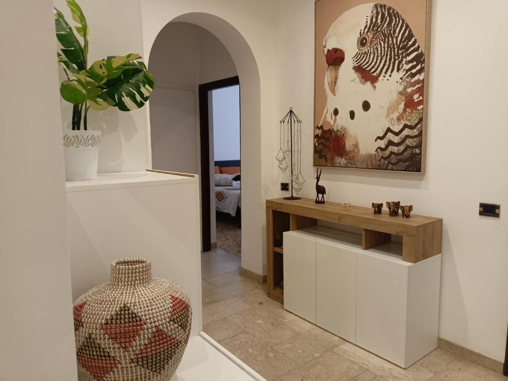 a living room with a table and a vase at Mura di prati in Rome