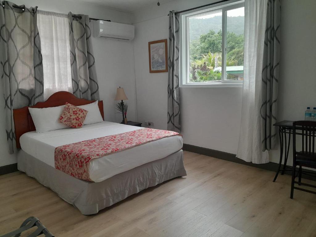 Postel nebo postele na pokoji v ubytování Villa Copthall