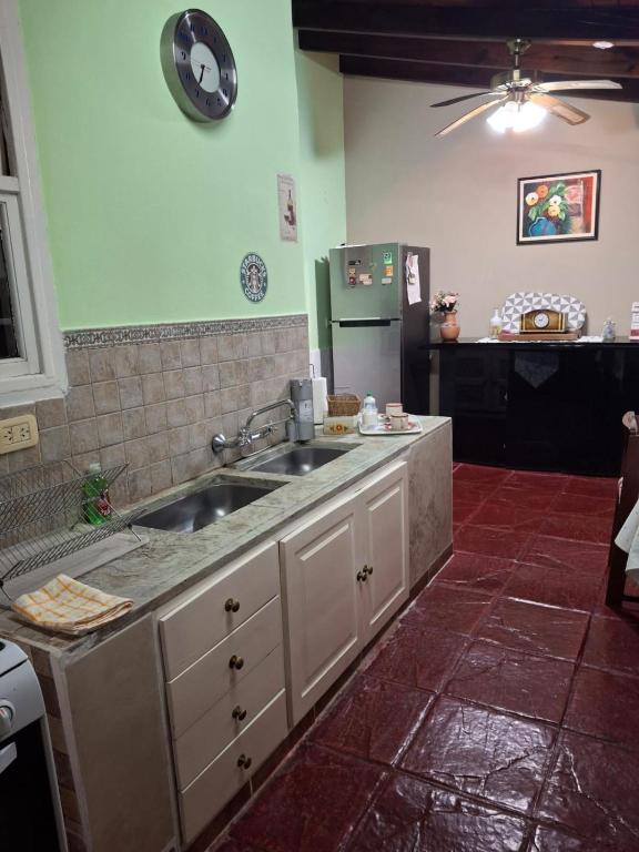 a kitchen with a sink and a counter at Un espacio en la naturaleza in Salta