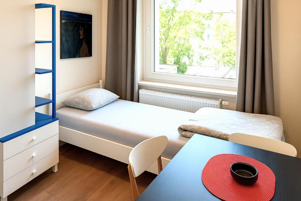 Uma cama ou camas num quarto em Babel Hostel, Dworzec PKP, Rynek