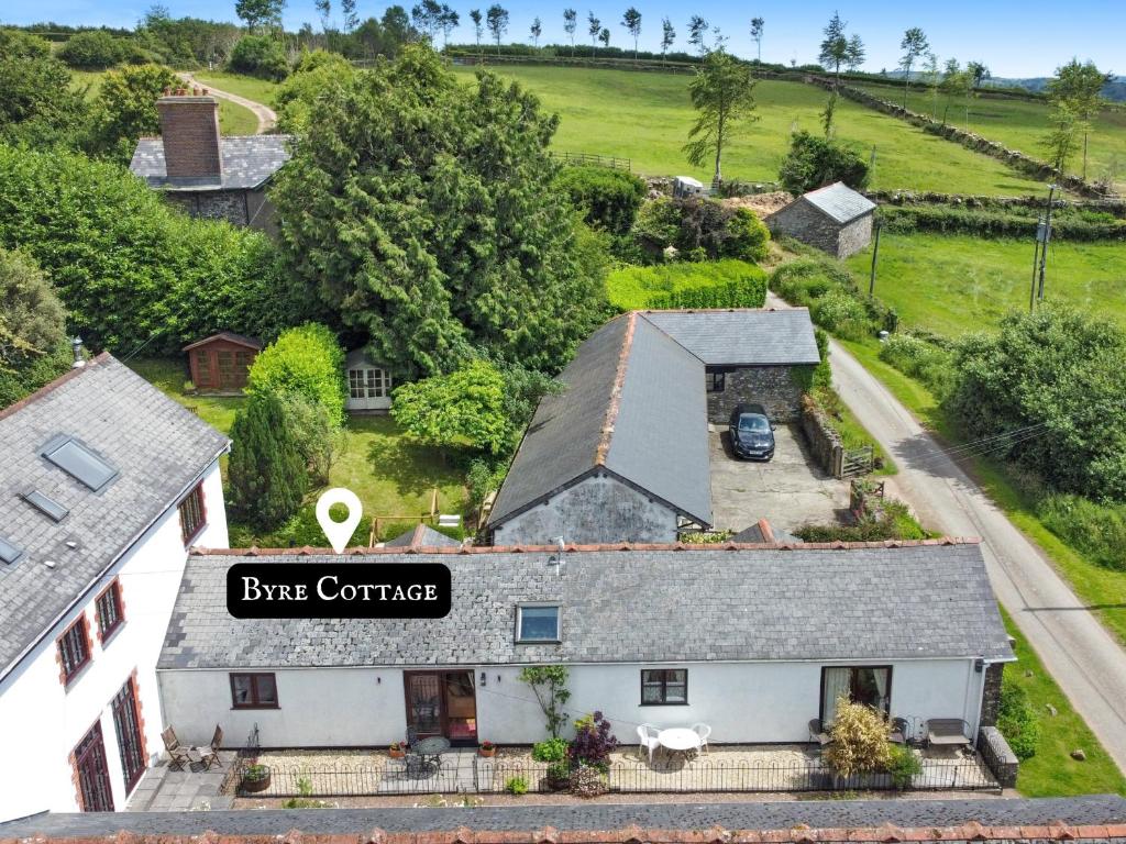 an aerial view of a house with a sign that reads bike center at Byre Cottage Dulverton in Dulverton