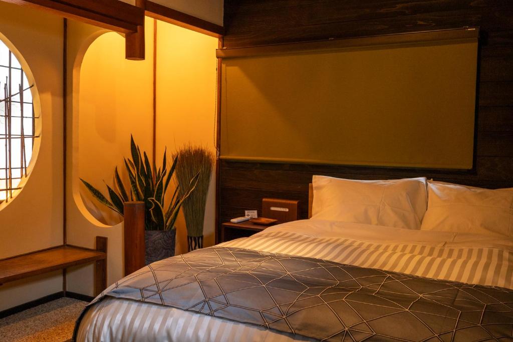 Postel nebo postele na pokoji v ubytování Sawara-鰆- 尾道の一棟貸し宿