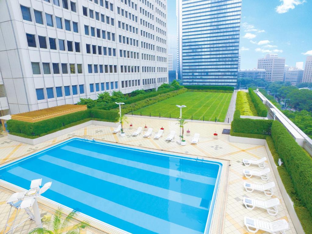 a swimming pool on the roof of a building at Keio Plaza Hotel Tokyo in Tokyo