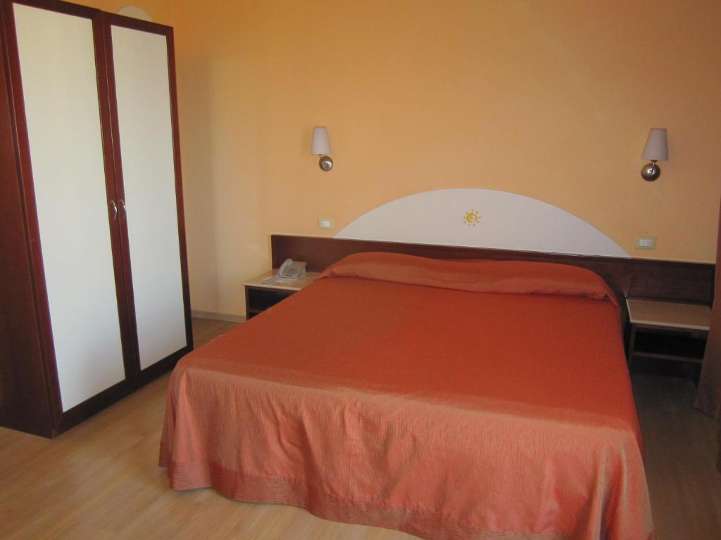 Postel nebo postele na pokoji v ubytování Hotel Al Sole - ENJOY HOLIDAY