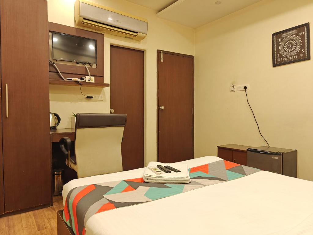 Postel nebo postele na pokoji v ubytování Loharkar Hotel