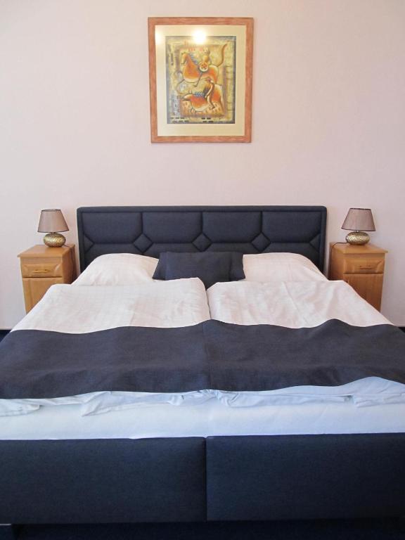 Postel nebo postele na pokoji v ubytování Hotel Růžek