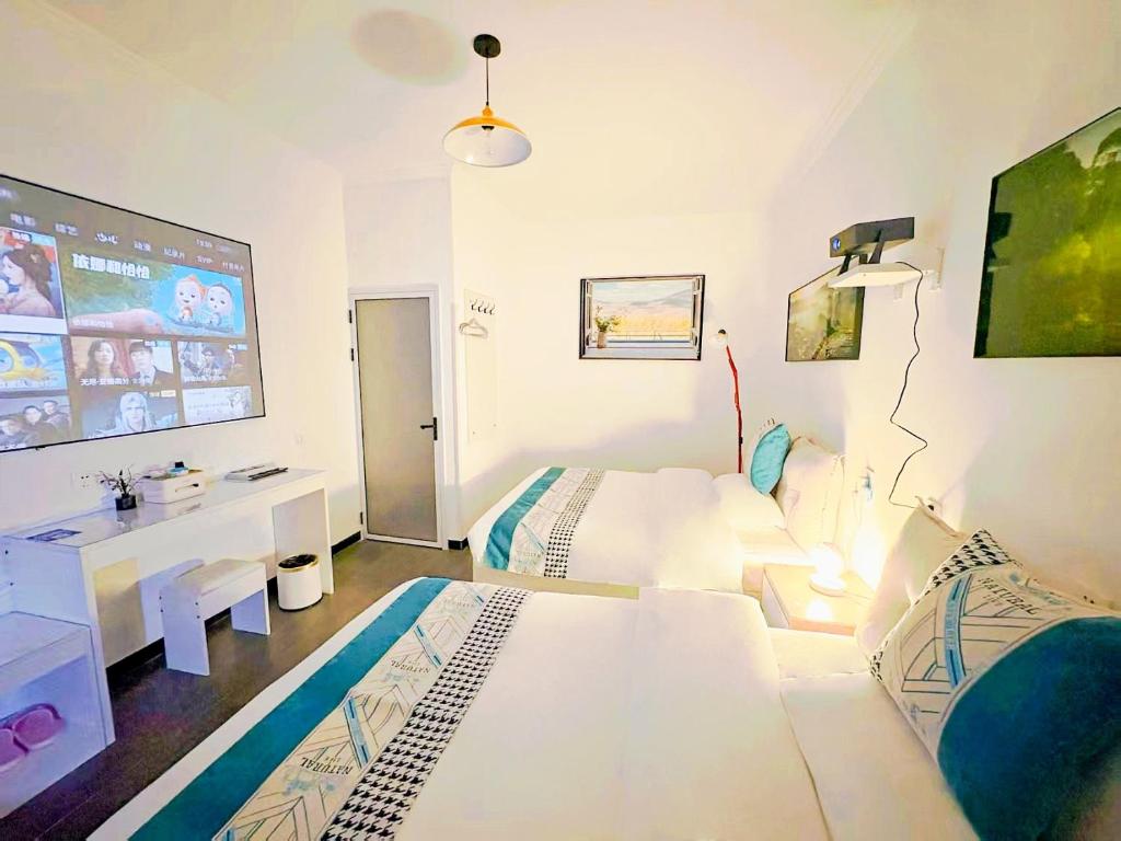 TV a/nebo společenská místnost v ubytování Beijing Great Wall Shiguang Homestay
