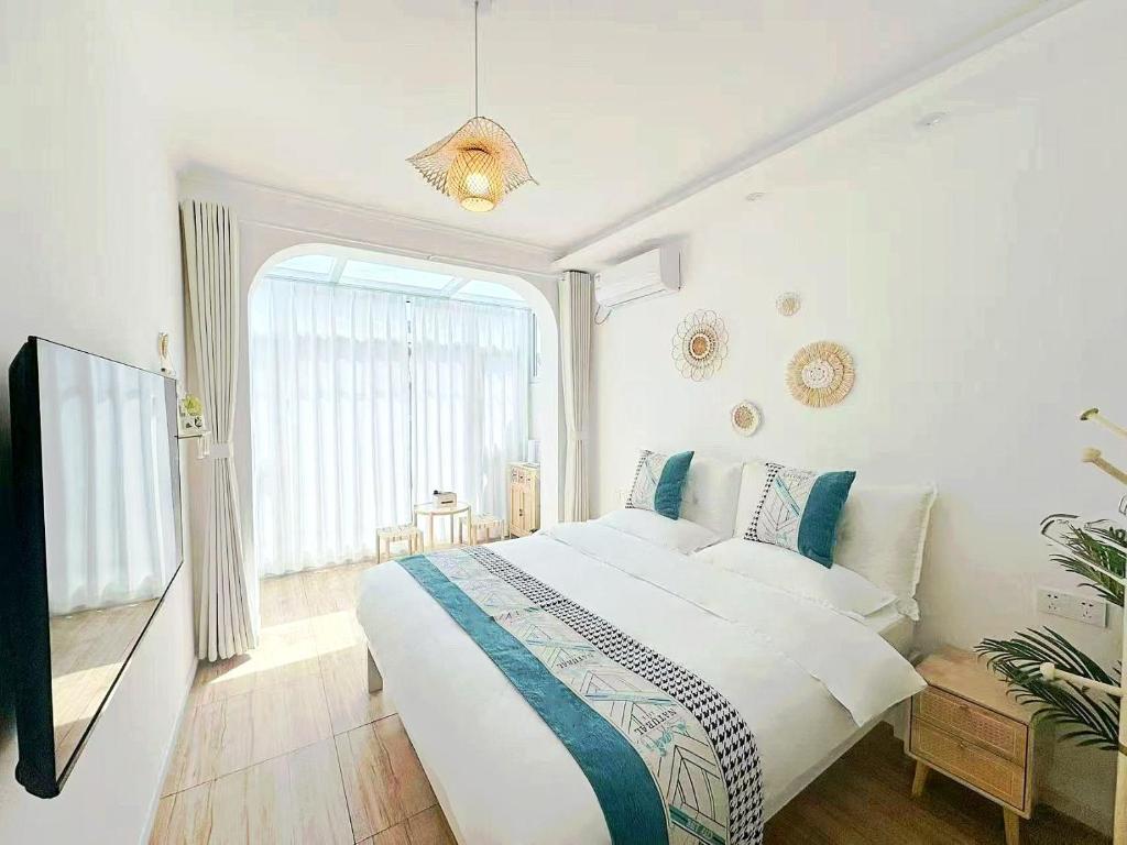 Postel nebo postele na pokoji v ubytování Beijing Great Wall Shiguang Homestay