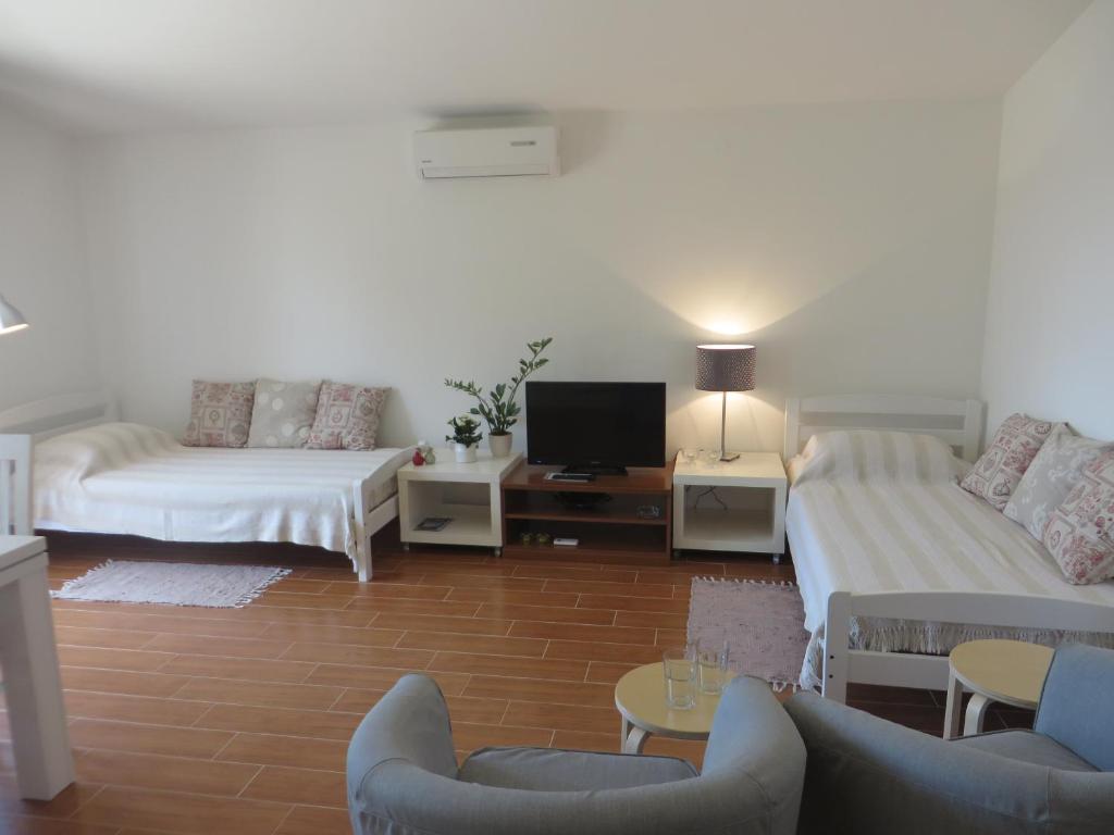 Posteľ alebo postele v izbe v ubytovaní Filipovic Apartments with Pool