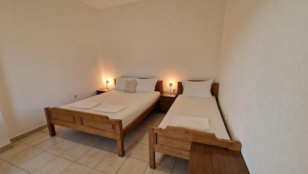 Łóżko lub łóżka w pokoju w obiekcie Apartmani Kod Barbe