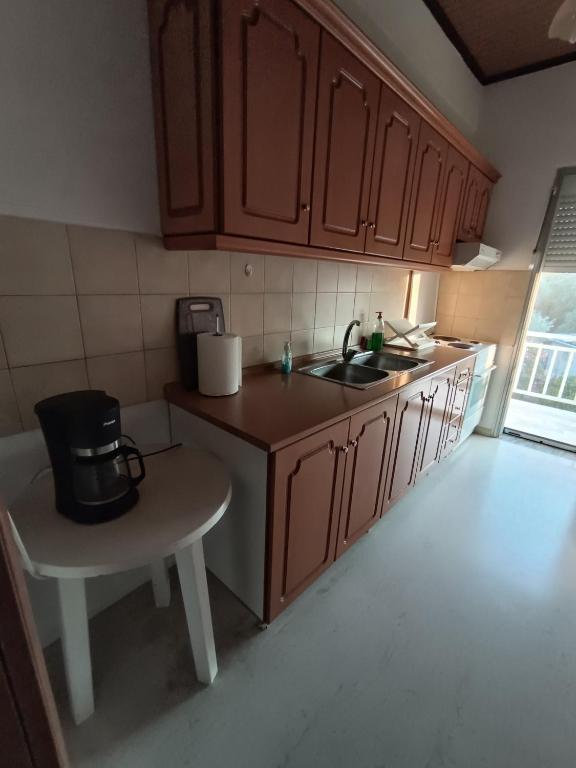 Kuchyň nebo kuchyňský kout v ubytování Soti's Rooms