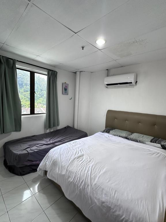 Postel nebo postele na pokoji v ubytování coralbay apartment pangkor island