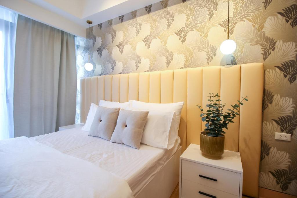 Postel nebo postele na pokoji v ubytování Cylo's Place Manhattan