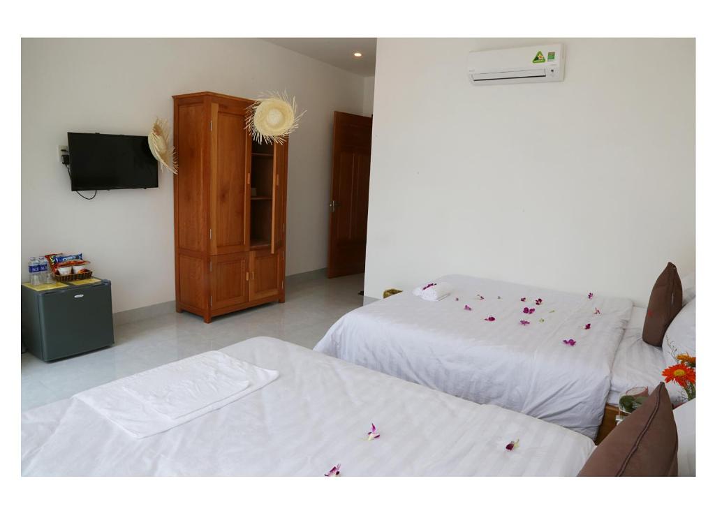 Postel nebo postele na pokoji v ubytování Danang Beach 2 Hotel