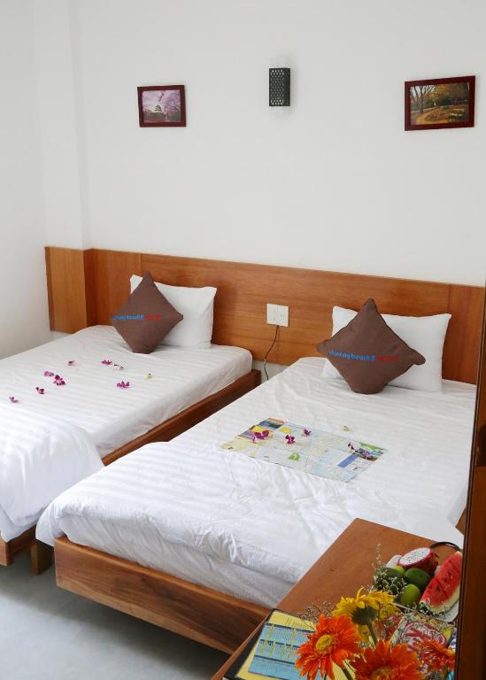 Postel nebo postele na pokoji v ubytování Danang Beach 2 Hotel