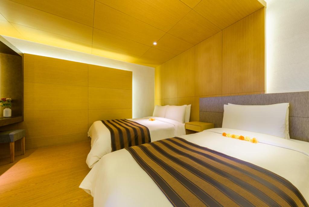 Postel nebo postele na pokoji v ubytování STANFORD Hotel & Resort Jeju