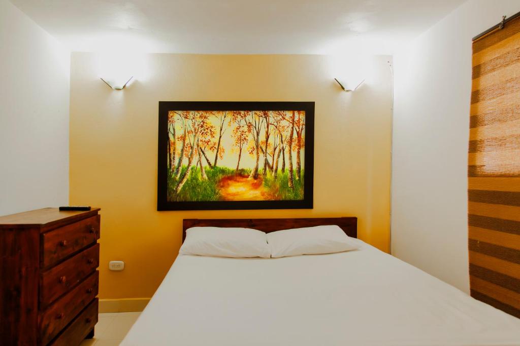 Postel nebo postele na pokoji v ubytování Finca Hotel La Ponderosa