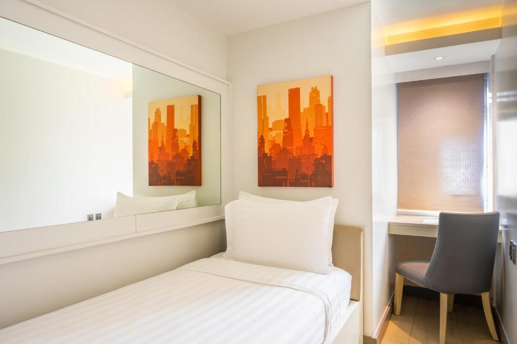 Postel nebo postele na pokoji v ubytování The Mini Suites Eton Tower Makati