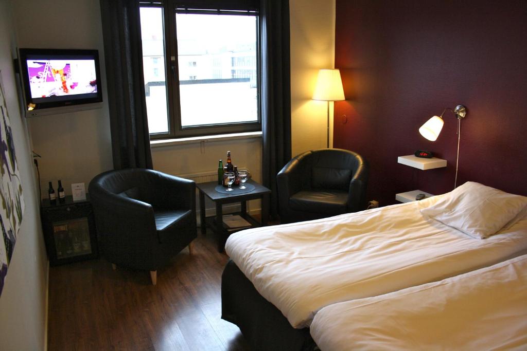 Postel nebo postele na pokoji v ubytování Centralhotellet