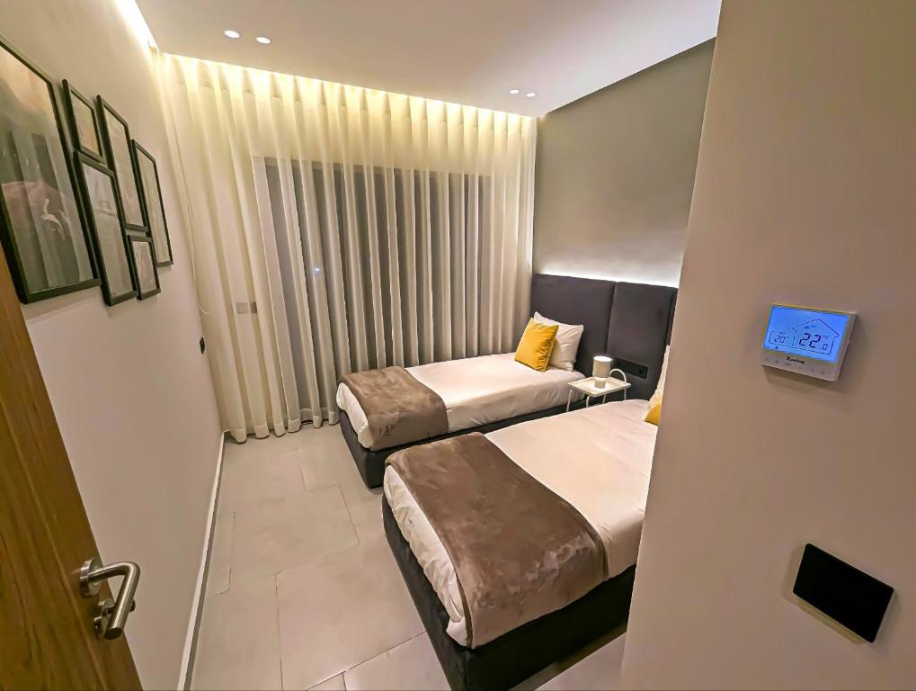 Postel nebo postele na pokoji v ubytování EliteStay by Al Amir