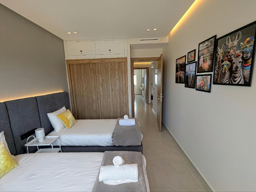 Postel nebo postele na pokoji v ubytování EliteStay by Al Amir