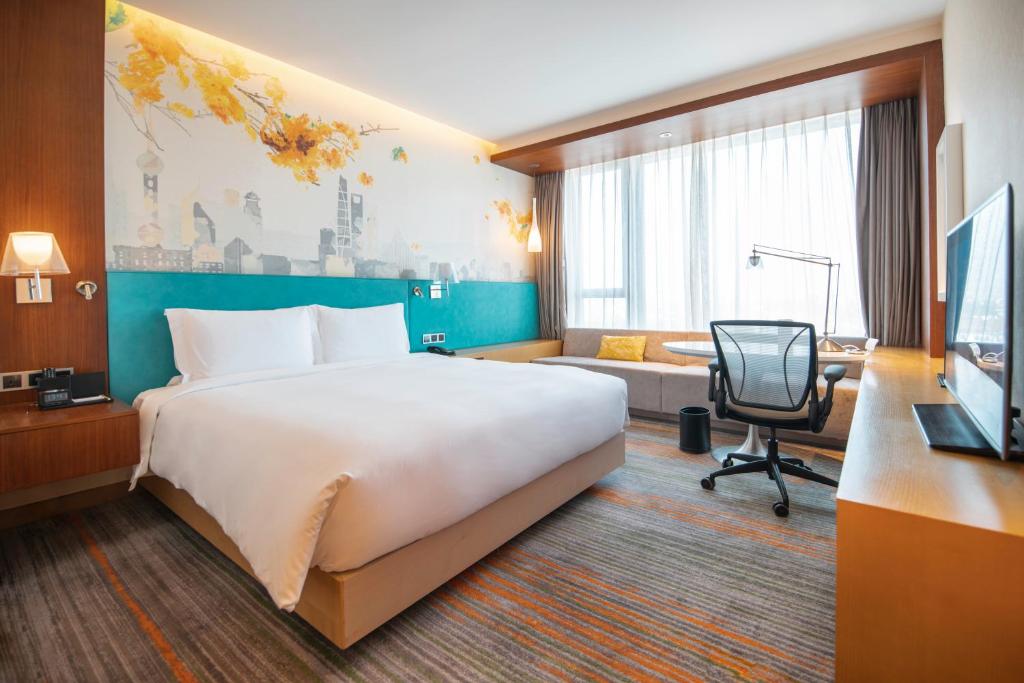 Postel nebo postele na pokoji v ubytování Hilton Garden Inn Shanghai Hongqiao NECC