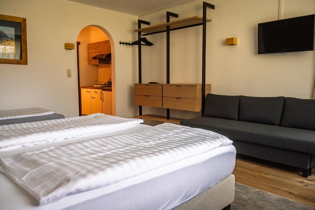 Postel nebo postele na pokoji v ubytování Alpenhaus Monte