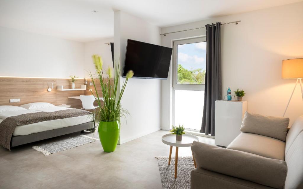 Postel nebo postele na pokoji v ubytování NOVALIS Hotel by AURUM Dresden