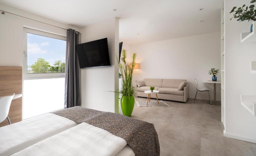 Postel nebo postele na pokoji v ubytování NOVALIS Hotel by AURUM Dresden