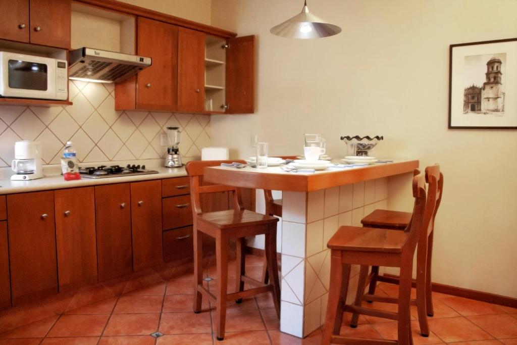 Kuchyň nebo kuchyňský kout v ubytování Alcazar Suites