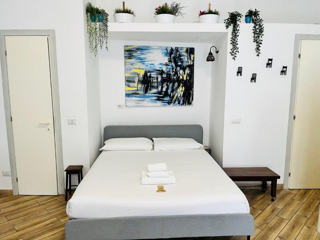Ένα ή περισσότερα κρεβάτια σε δωμάτιο στο Holidays in Rome at Luigi's - Trastevere