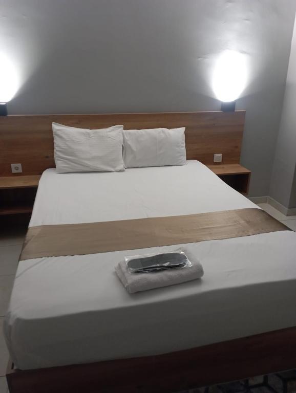 Postel nebo postele na pokoji v ubytování Rosse Hotel